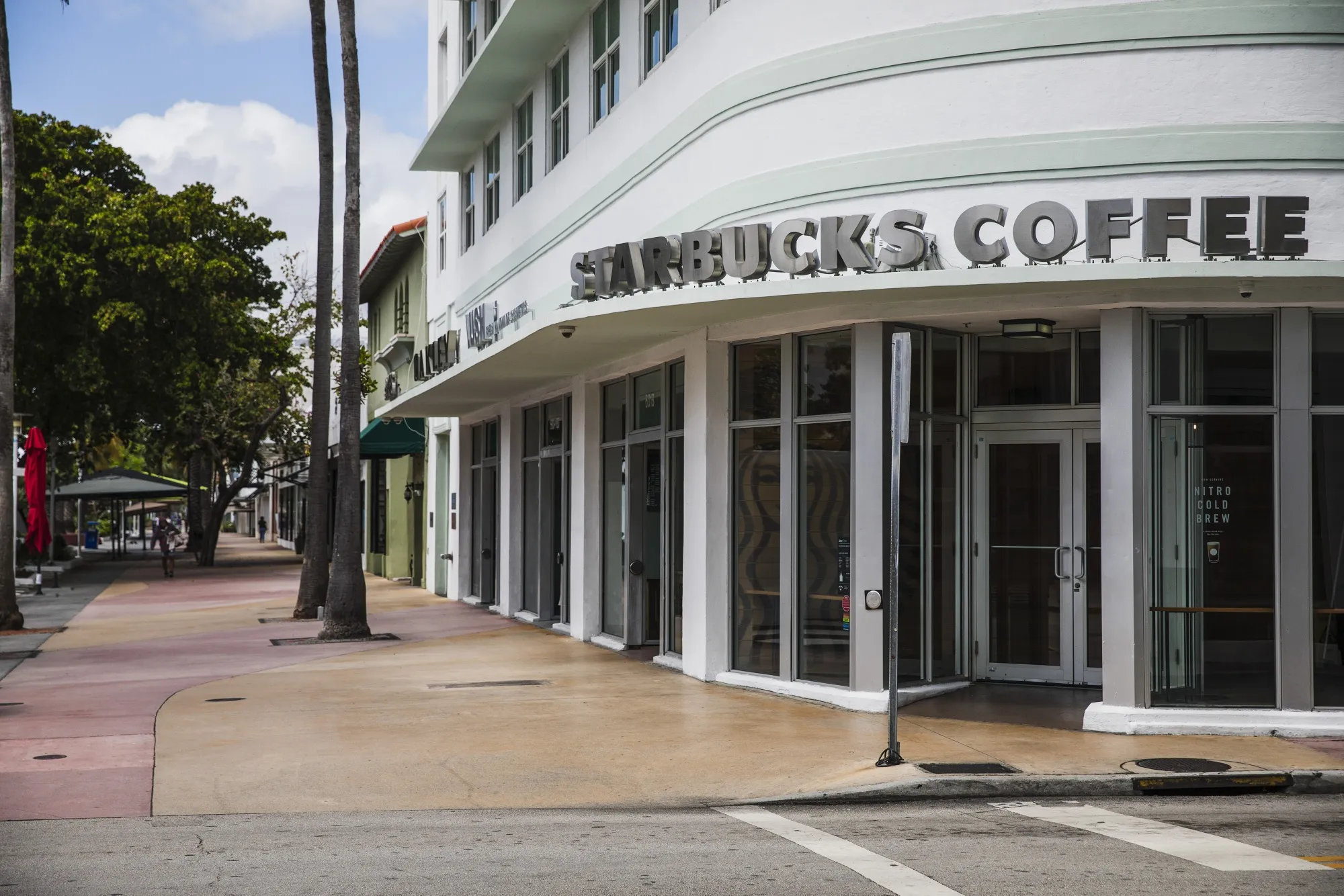 A Starbucks coffee shop stands on an empty avenue of Lincoln Road Mall in the South Beach neighborhood of Miami Beach, Florida on March 20.&nbsp;