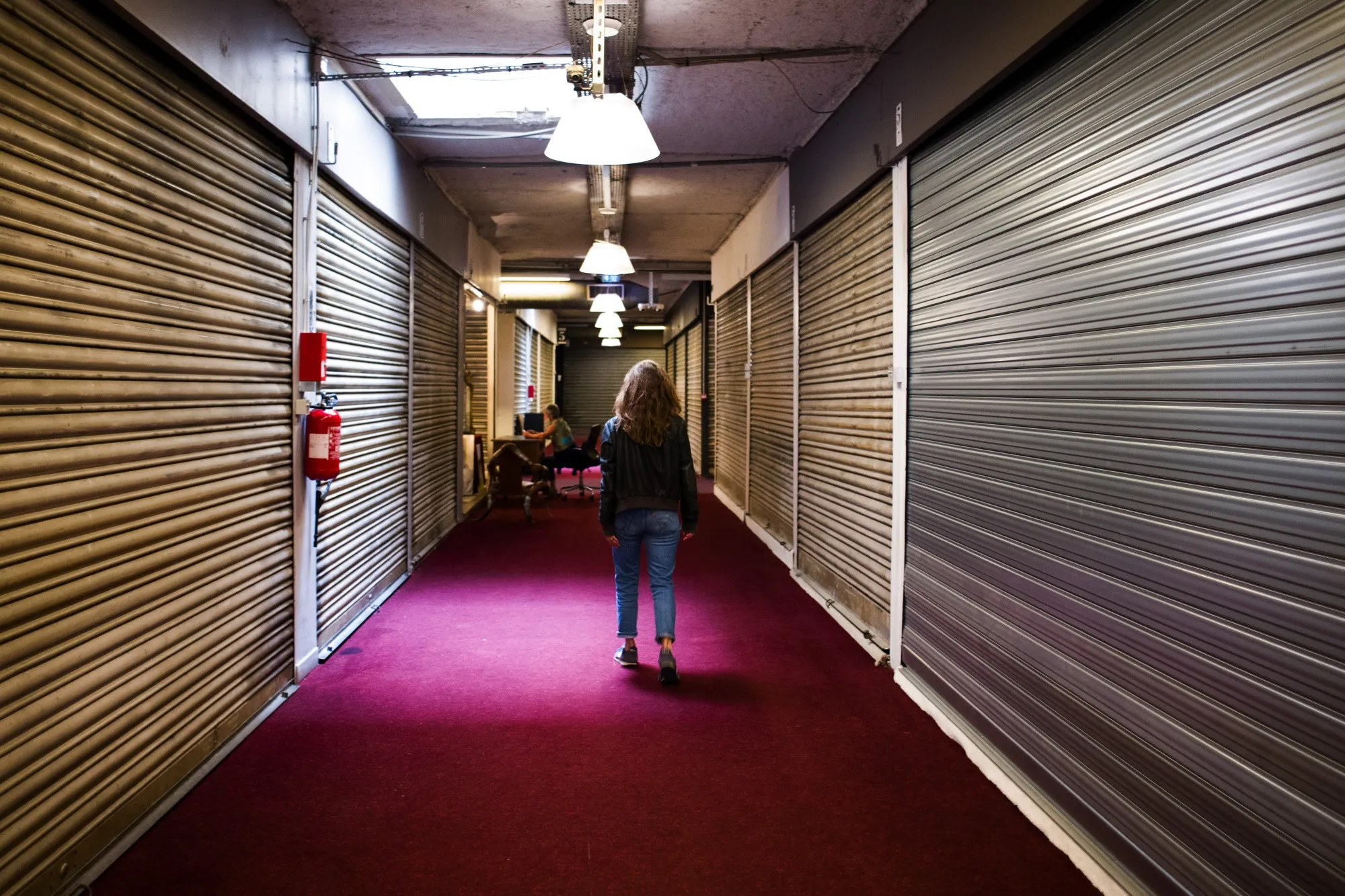 A pedestrian passes closed stores at a&nbsp;market in Paris.