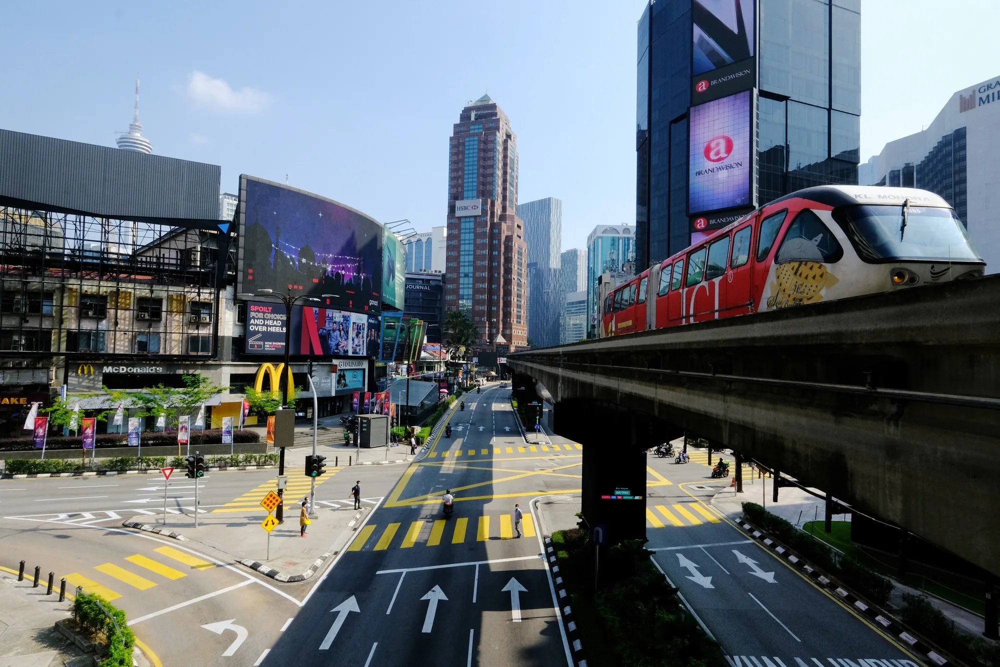 A Rapid KL train travels along an elevated track above deserted streets during a nationwide Movement Control Order (MCO) in Kuala Lumpur on May 25.