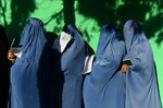 Afghan women wait in line to vote at a polling station on Oct. 20