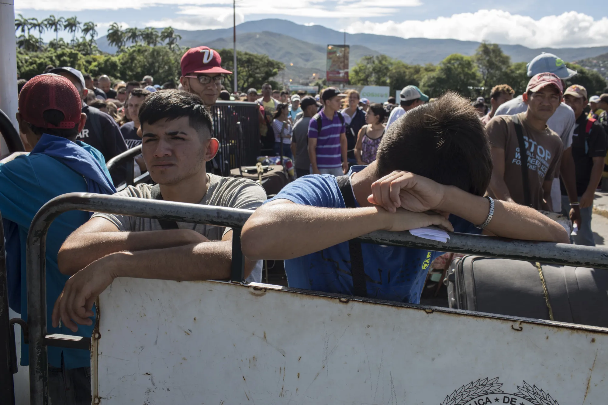People stand on line to show customs identification documents from Venezuela to enter into Cucuta, Colombia, on Monday, Sept. 18, 2017.&nbsp;