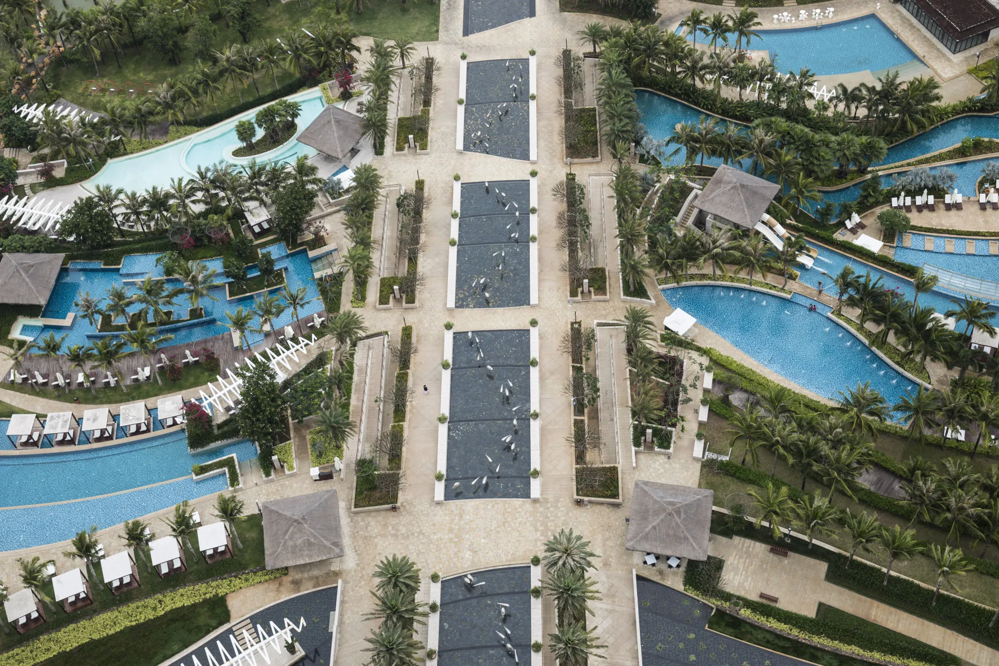 Swimming pools are seen at the Mangrove Sanya hotel resort, operated by Antaeus Group, in Sanya, Hainan province, China.