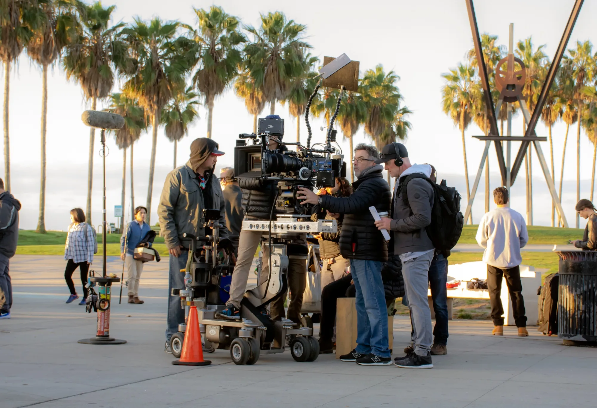 Hollywood camera crew films scene for television show NCIS Los Angeles on the Venice Beach boardwalk.
