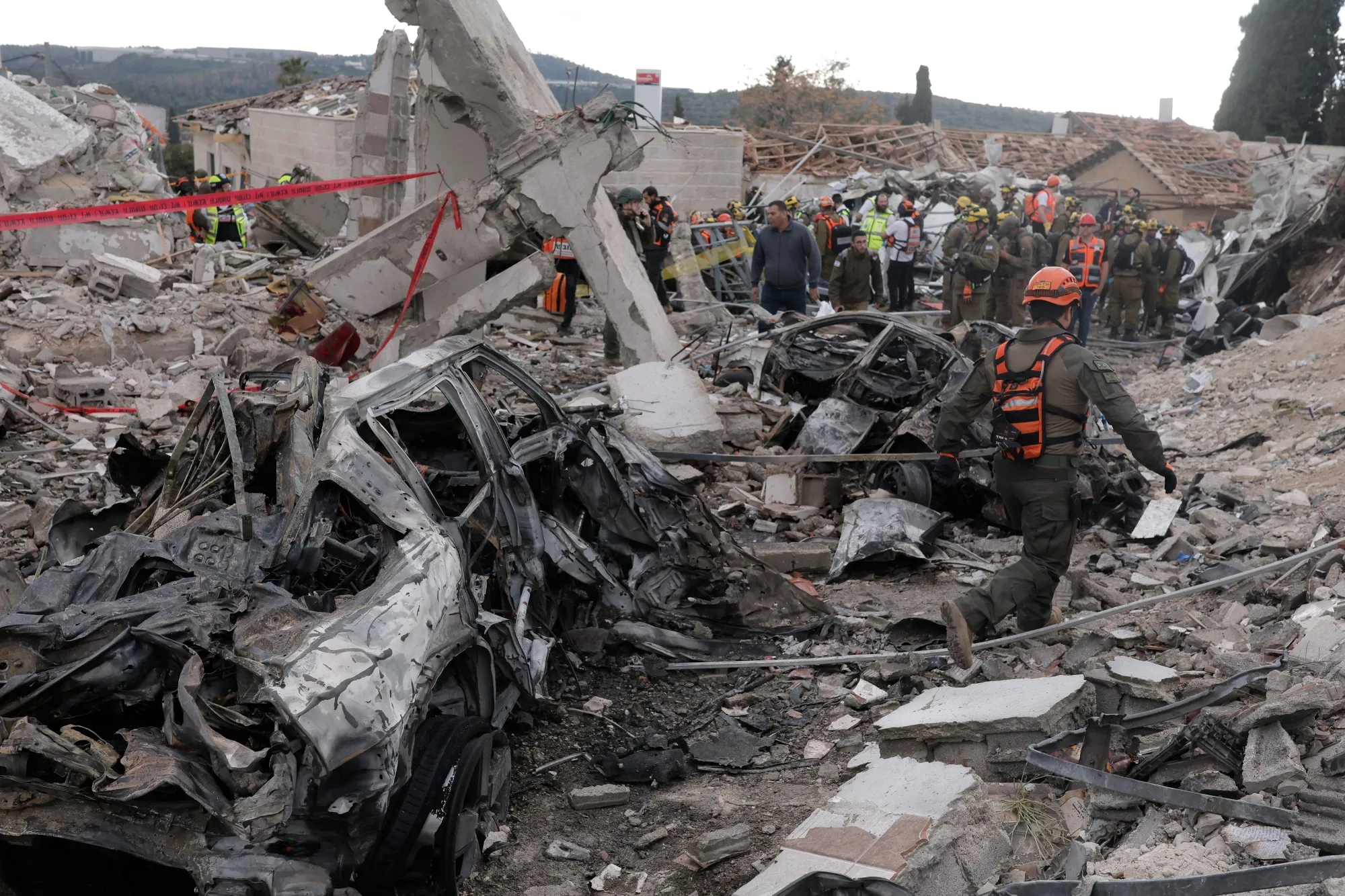 Rescue workers and military personnel at the site of an Iranian missile strike in Beit Shemesh, Israel, on&nbsp;March 1.