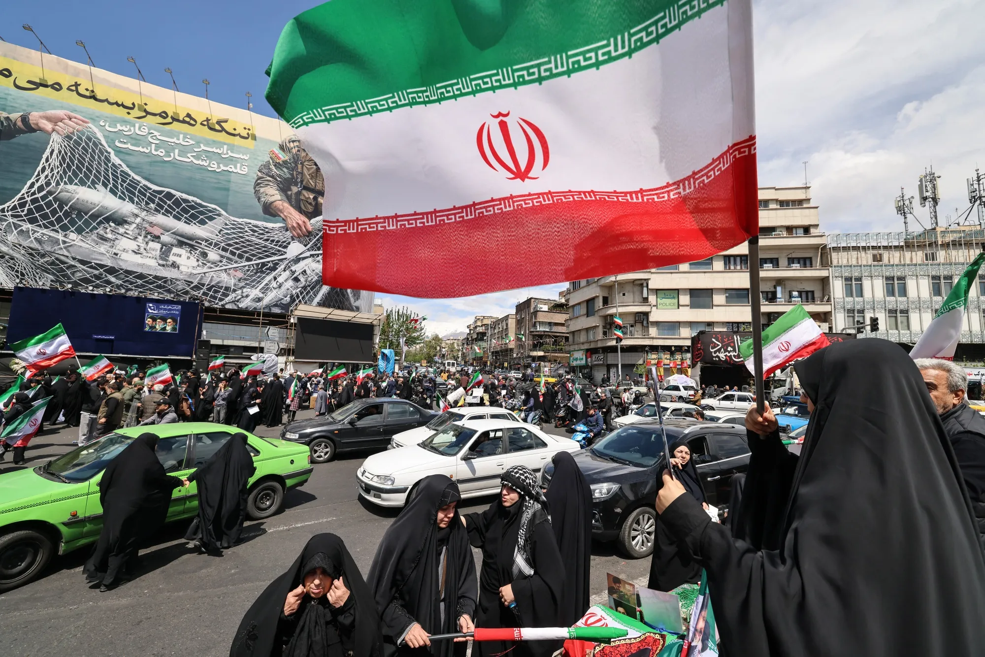 Iranians with national flags on Revolution Square, Tehran, on April 8.