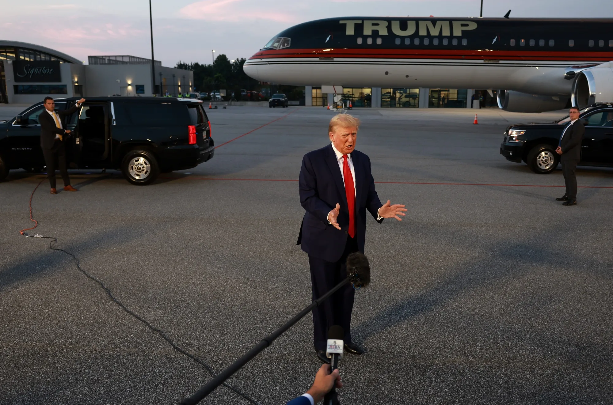 Donald Trump at Atlanta Hartsfield-Jackson International Airport after surrendering at the Fulton County jail on Aug. 24.