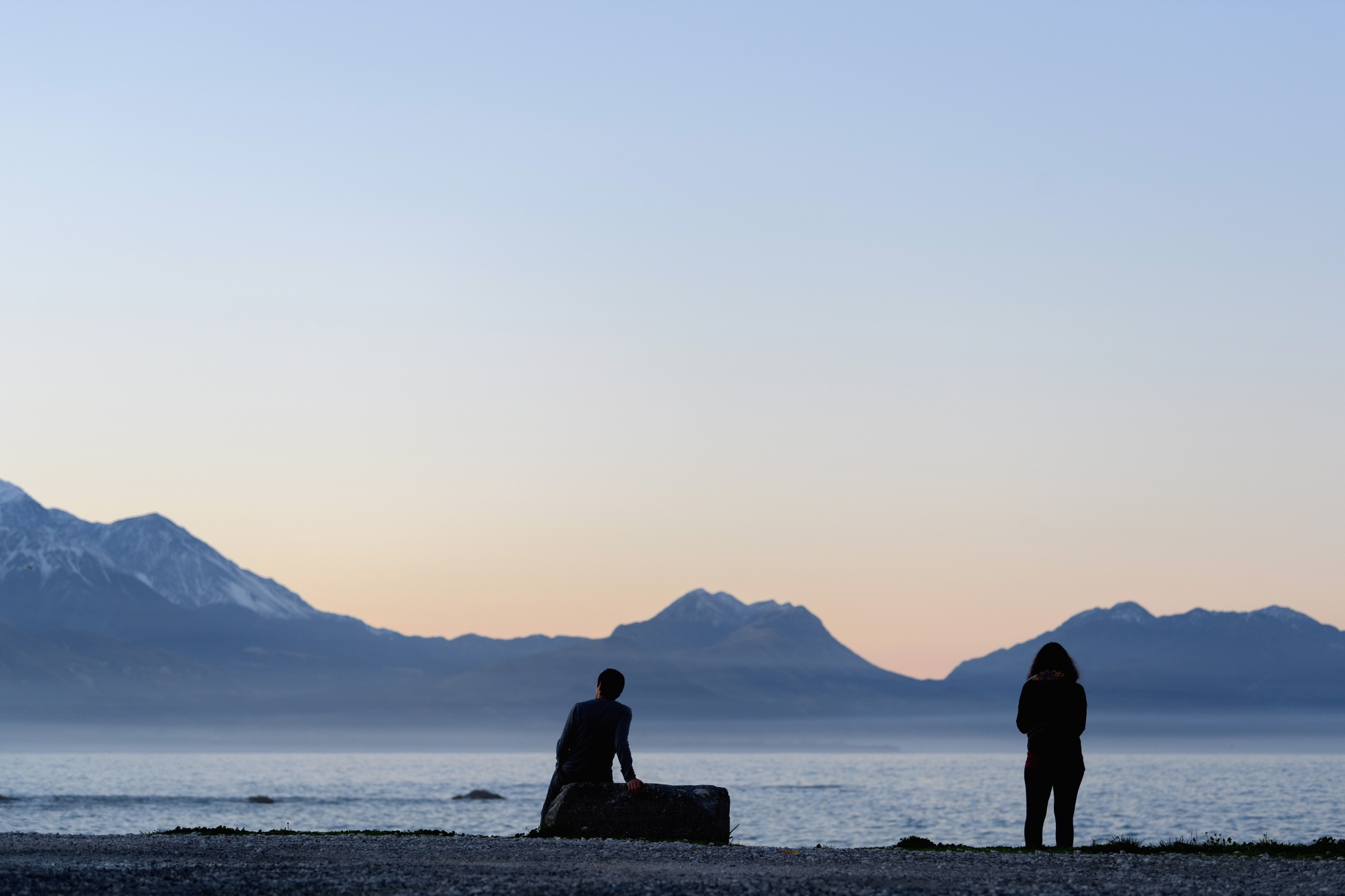 Tourists watch the sunset in Kaikoura, New Zealand.