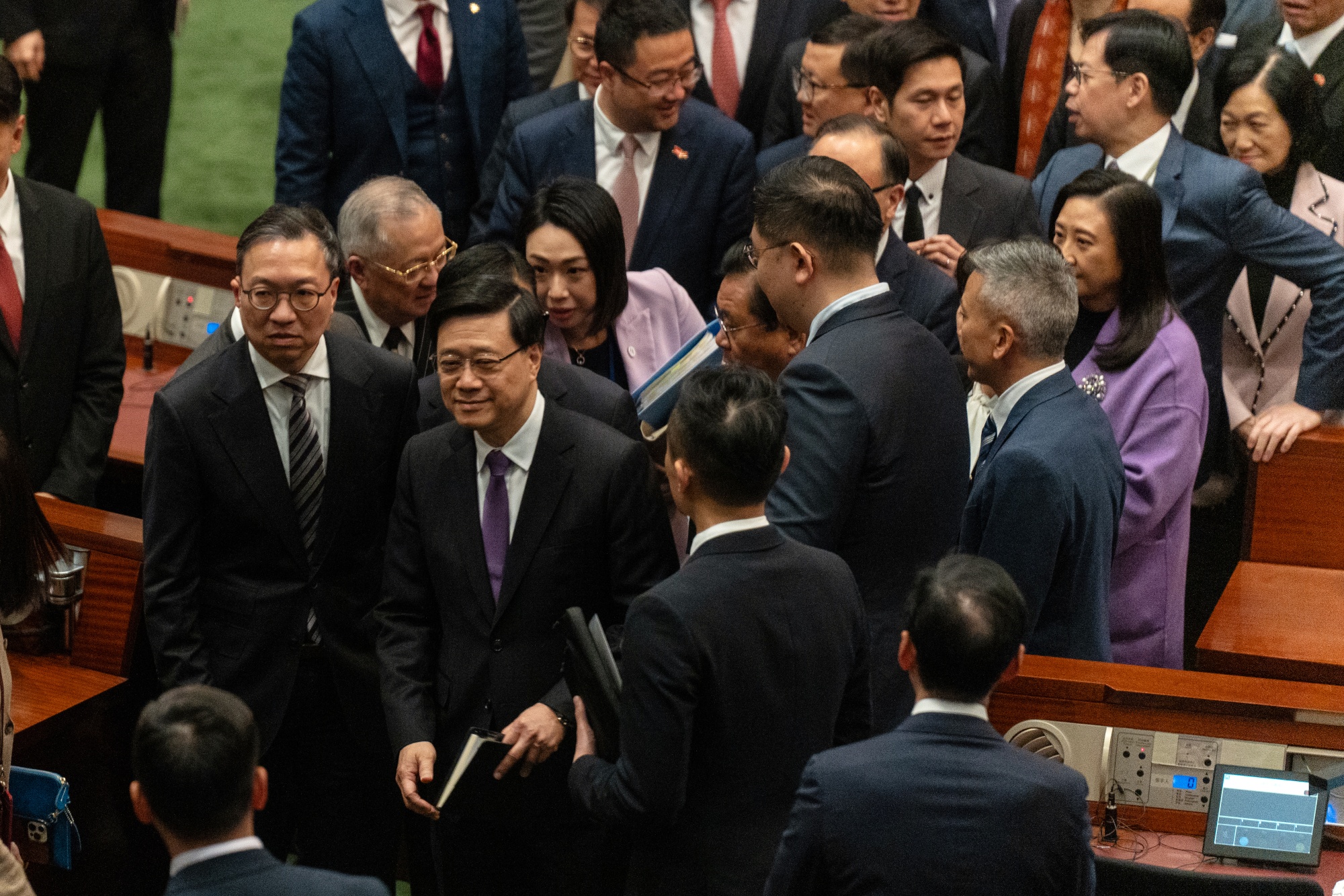 John Lee, center, following the passing of Article 23 at the Legislative Council in Hong Kong, on March 19.