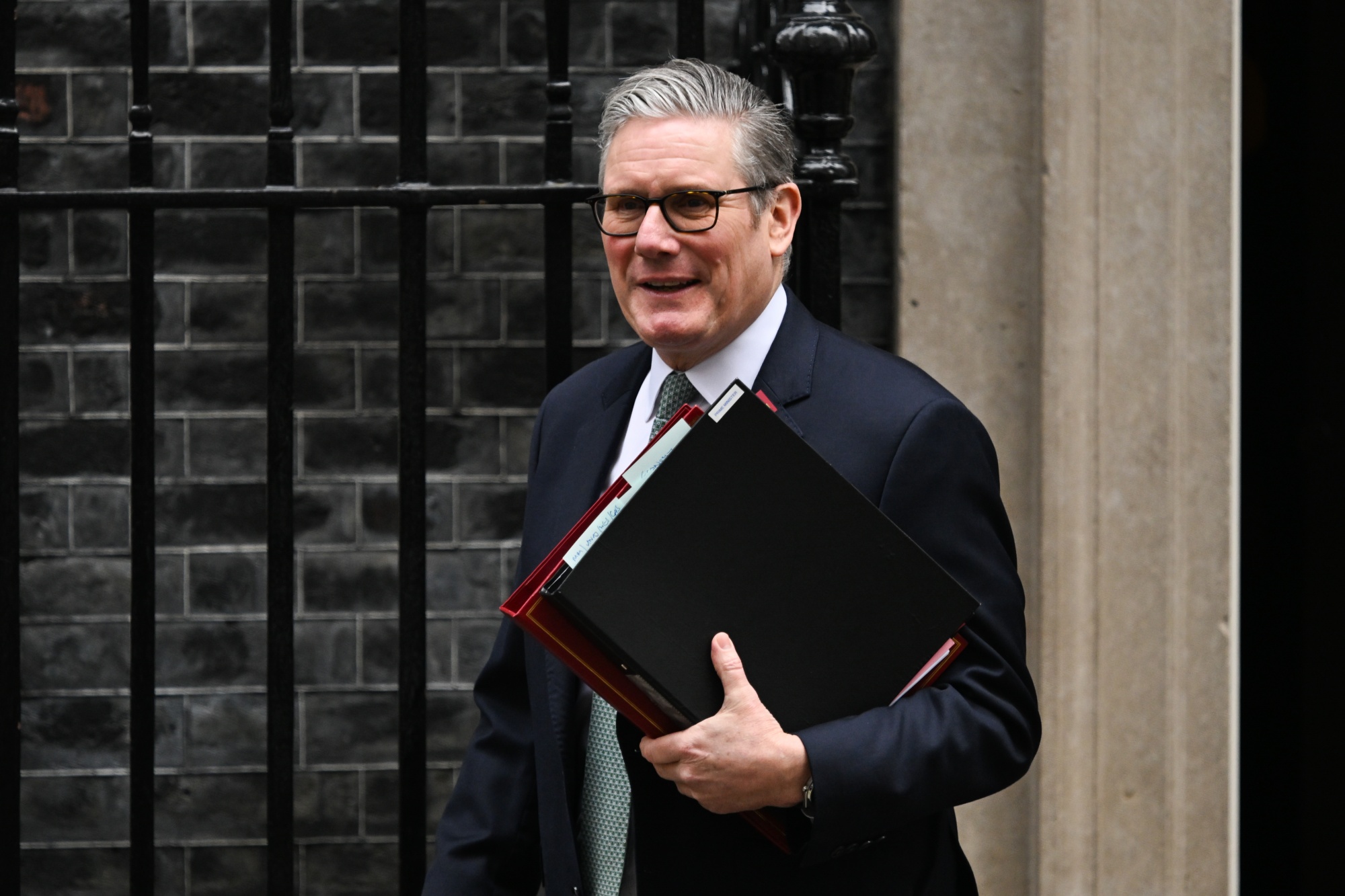 Keir Starmer, UK prime minister, leaves 10 Downing Street to attend Prime Ministers Questions in London, UK, on Wednesday, Feb. 11, 2026. The UK prime minister's position is seen as safe for the immediate future after every member of the cabinet on Monday publicly backed him to stay in his job, including Wes Streeting. Photographer: Chris J. Ratcliffe/Bloomberg