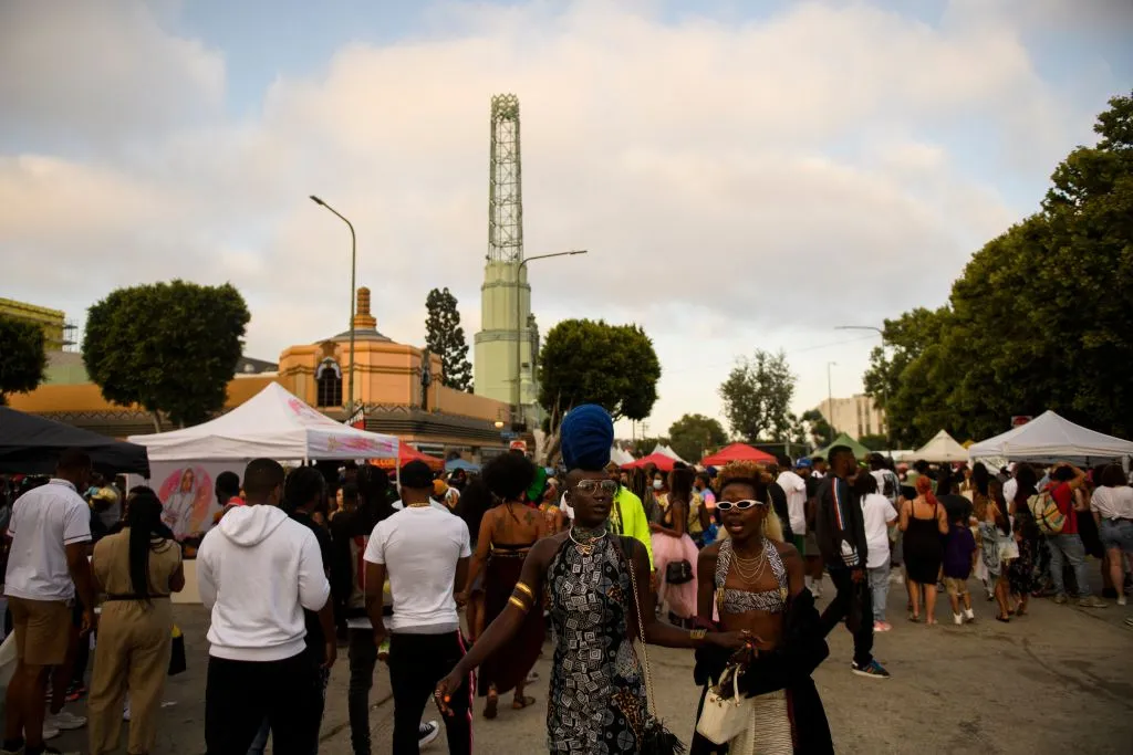 People walk past Leimert Park Plaza during a Juneteenth celebration in&nbsp;2021. The plaza is depicted in Jade Adia’s novel as the beating heart of a fictional neighborhood facing gentrification.&nbsp;