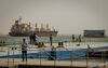 A ship sails along the Suez Canal waterway after the resumption of shipping traffic following the partial refloating of the 