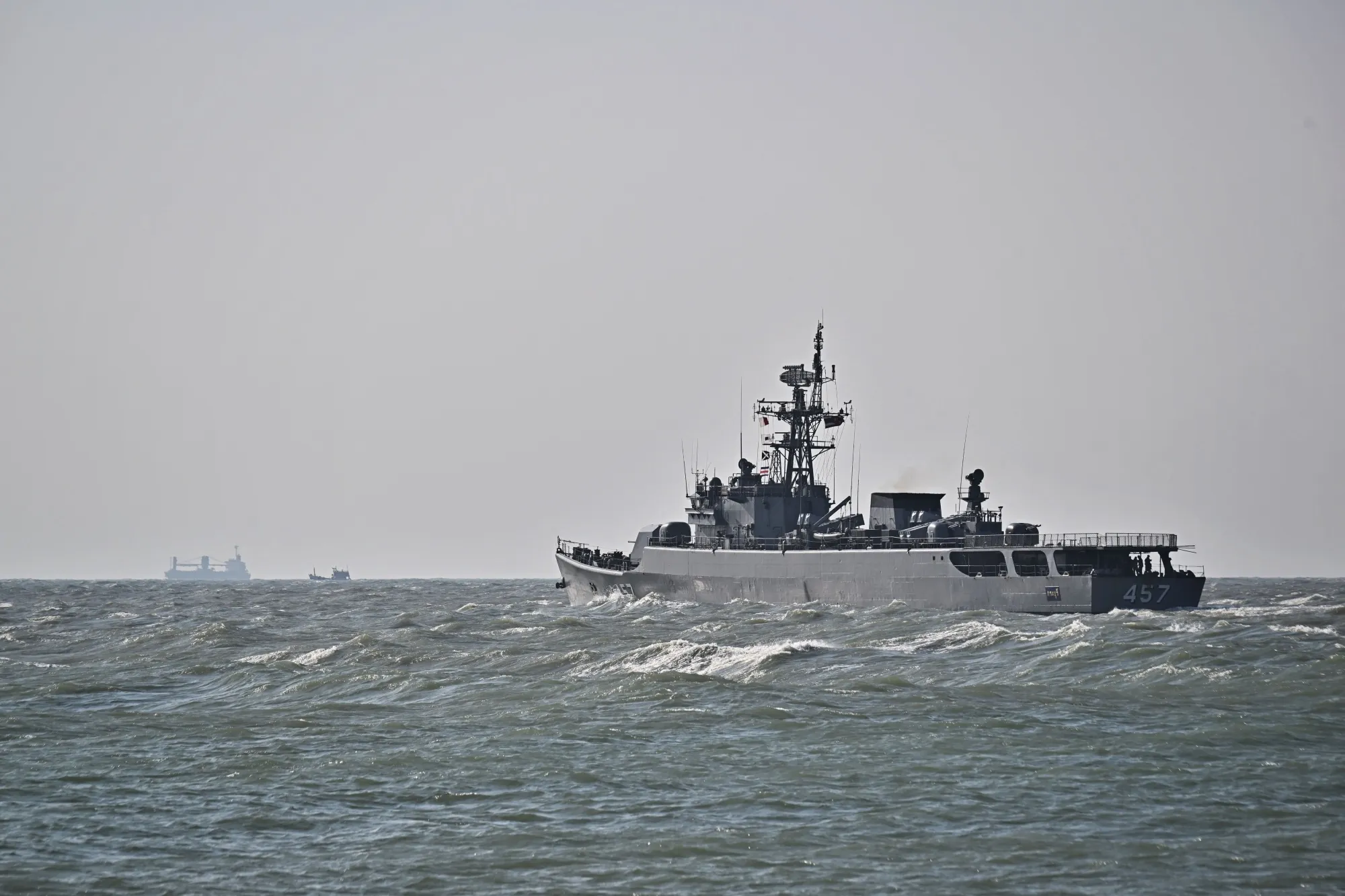 A Thai naval vessel leaves the port at Bang Saphan Pier in Prachuap Khiri Khan, Thailand.&nbsp;