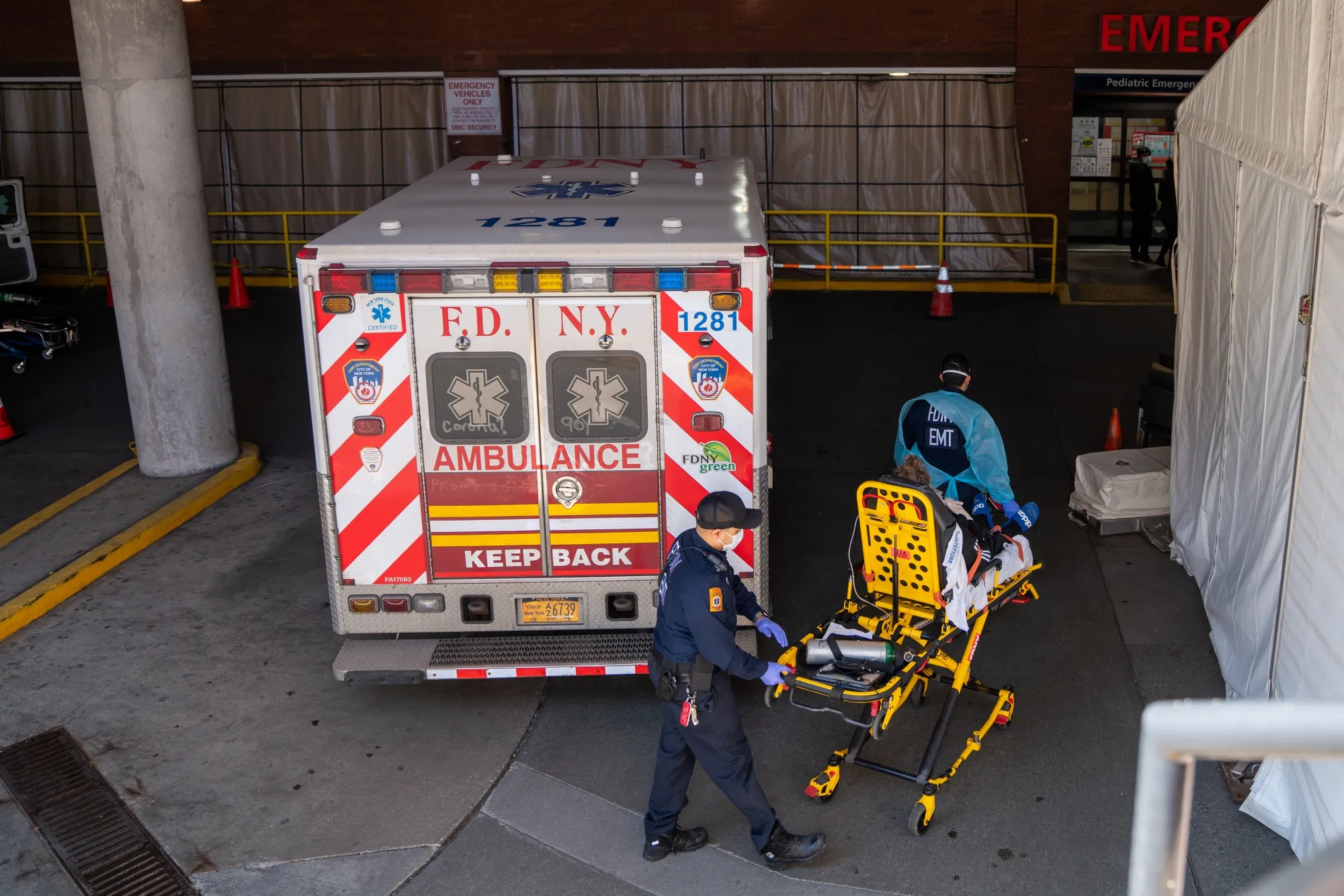 FDNY&nbsp;Emergency Medical Technicians (EMTs) bring a patient into the emergency room of Montefiore Hospital in the Bronx borough of New York on April 2.