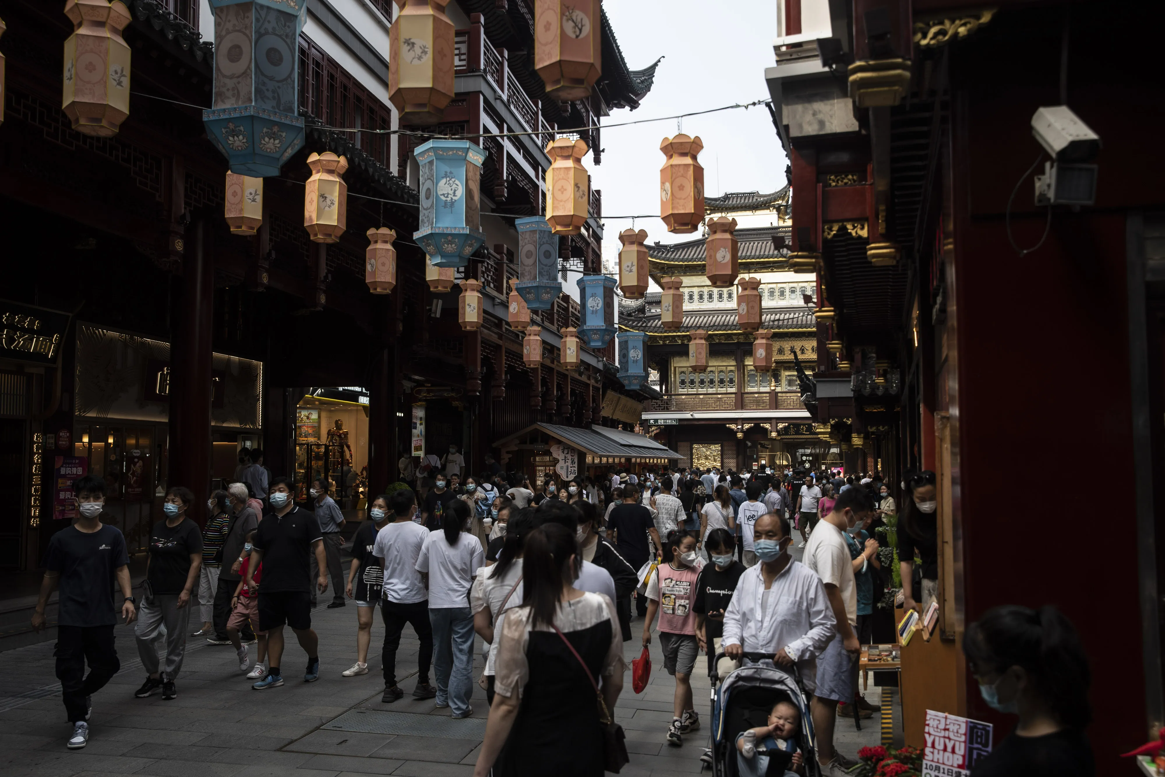 Visitors walk through the Yuyuan Garden in Shanghai.
