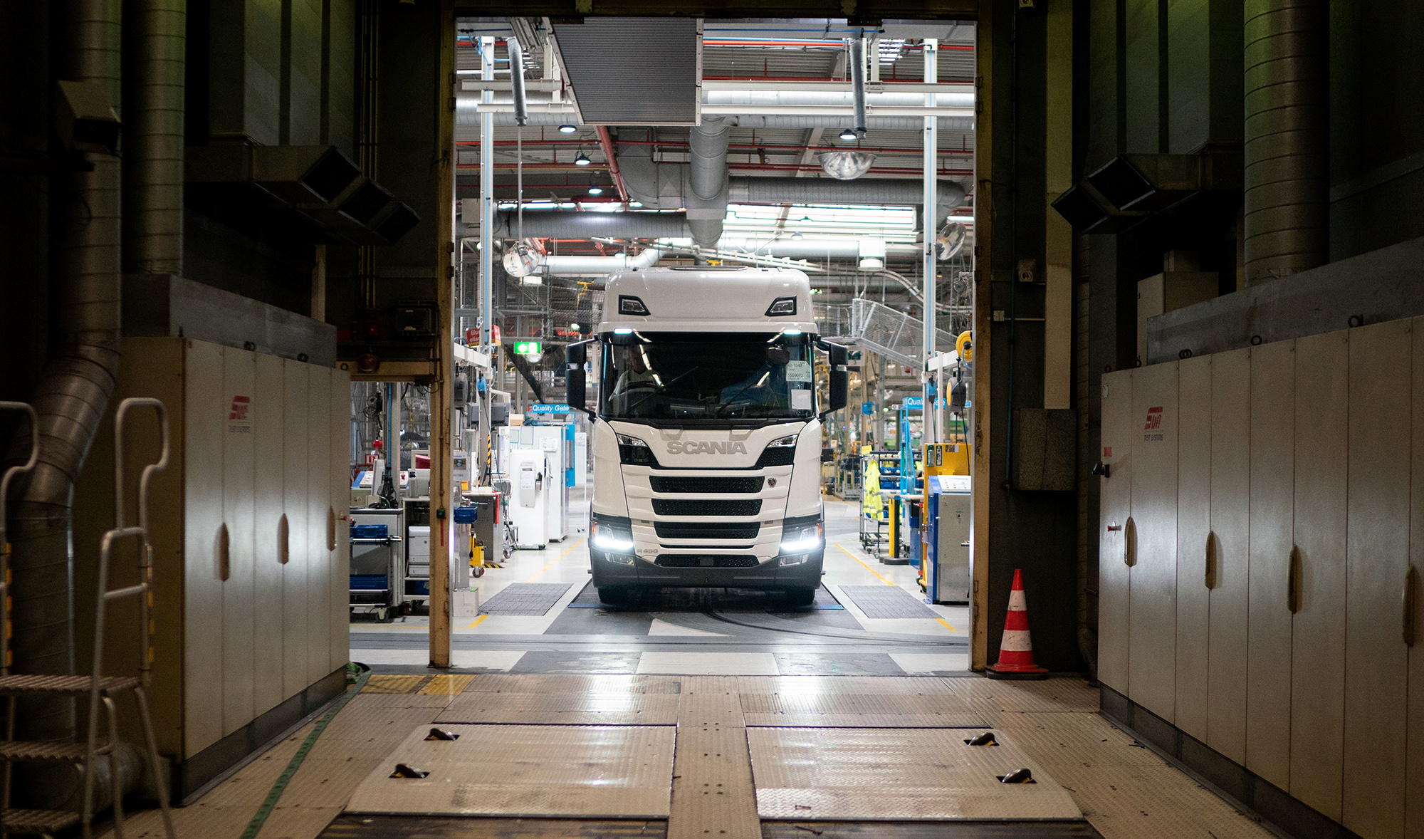 A fully assembled Scania R450 cargo truck drives on to a chassis dynamometer testing machine at the Scania factory in Zwolle, Netherlands.&nbsp;