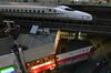 A Shinkansen bullet train travels along an elevated railway track near Yurakucho station in Tokyo on Sept. 8.