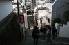 Visitors walk on a flight of stairs near the Kanda Myojin shrine on the first business day of the year in Tokyo, Japan, Monday, January 4, 2021. Japanese stocks declined on the first trading day of the year following reports of a state of emergency, with the benchmark Topix index falling as much as 1.6%.