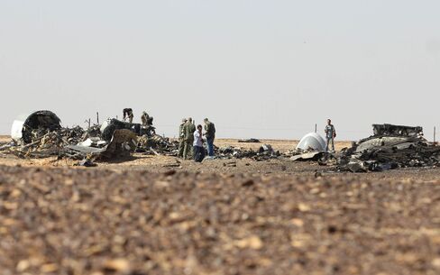 Russian officials inspect the wreckage