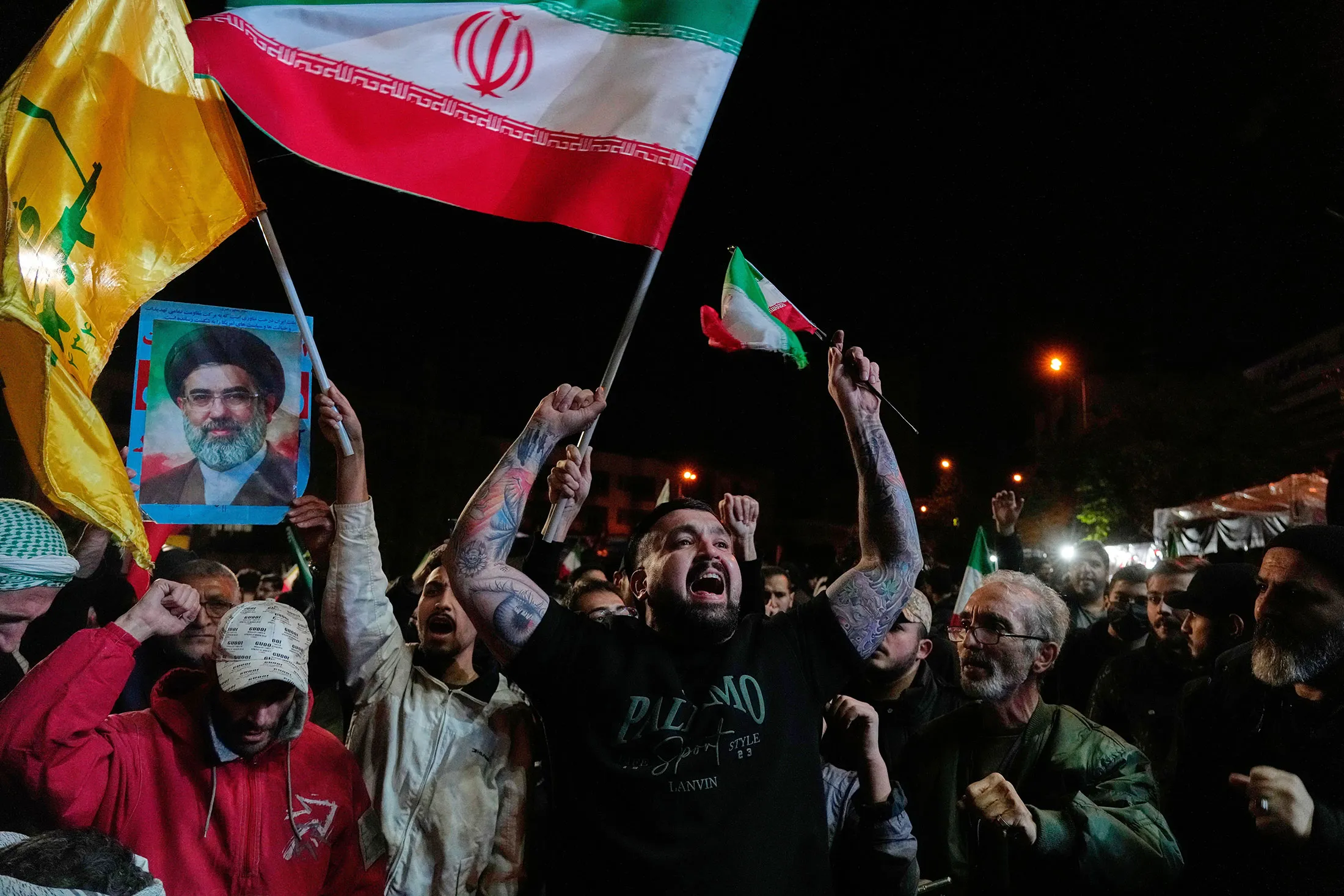 Pro-government demonstrators celebrate the ceasefire announcement in central Tehran on April 8.