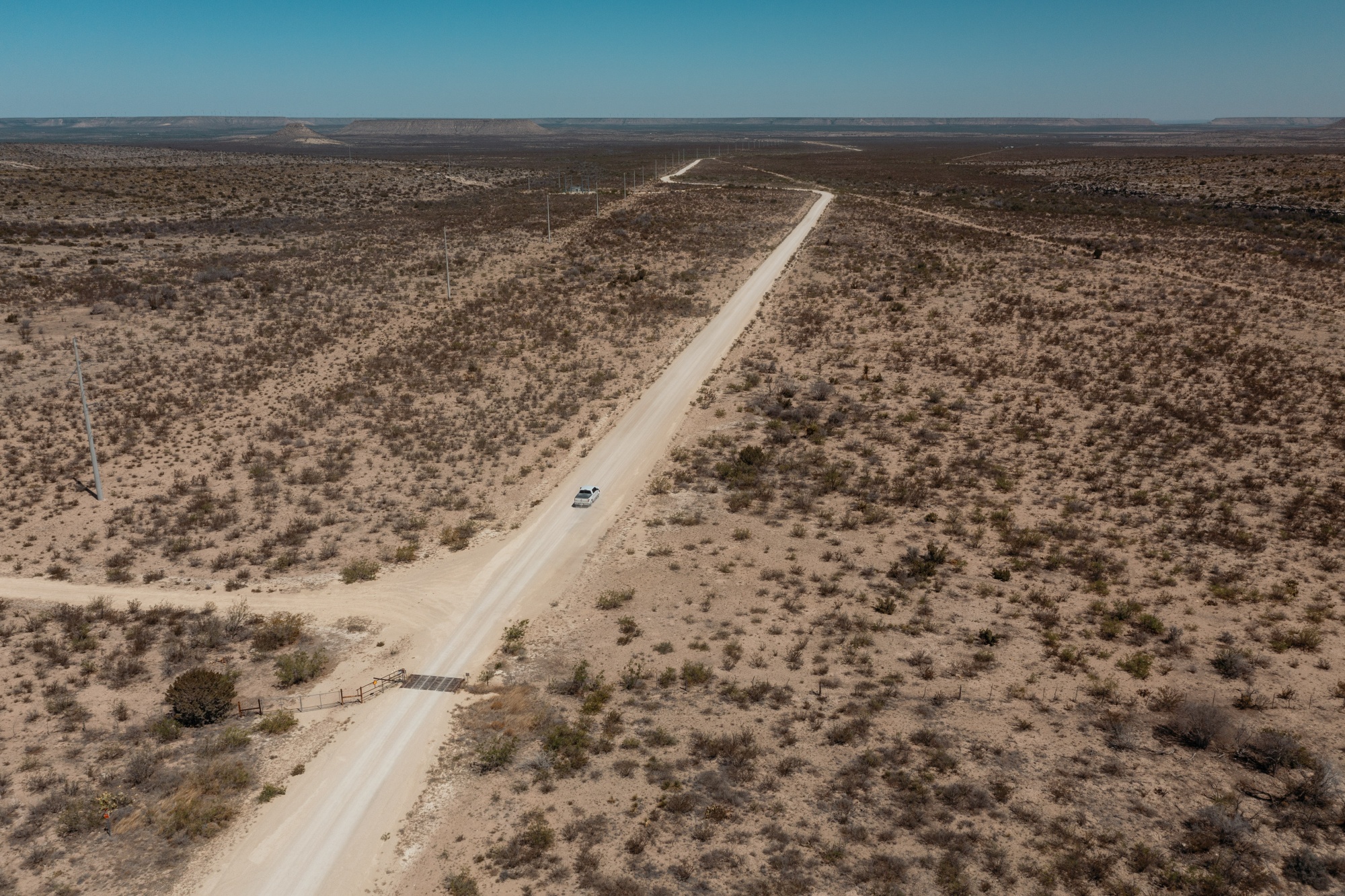 Nothing but dry brush along a dirt road leading from Interstate 10 to the Cormint Data Systems Bitcoin mining facility in Fort Stockton, Texas, U.S., on Friday, April 29, 2022. 