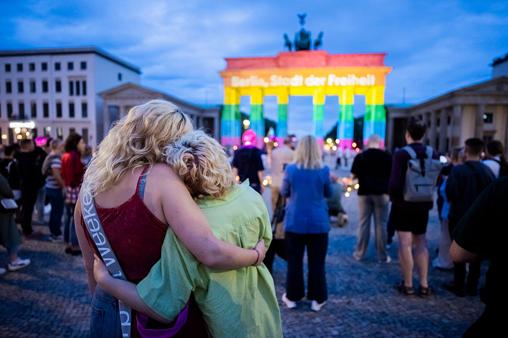 The Brandenburg Gate is illuminated in rainbow colors, displaying the words "Berlin, City of Freedom", following the attack. Photographer: picture alliance/Getty Images