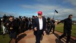 US billionaire Donald Trump (C) is pictured as he arrives at the Women's British Open Golf Championships in Turnberry, Scotland, on July 30, 2015.
