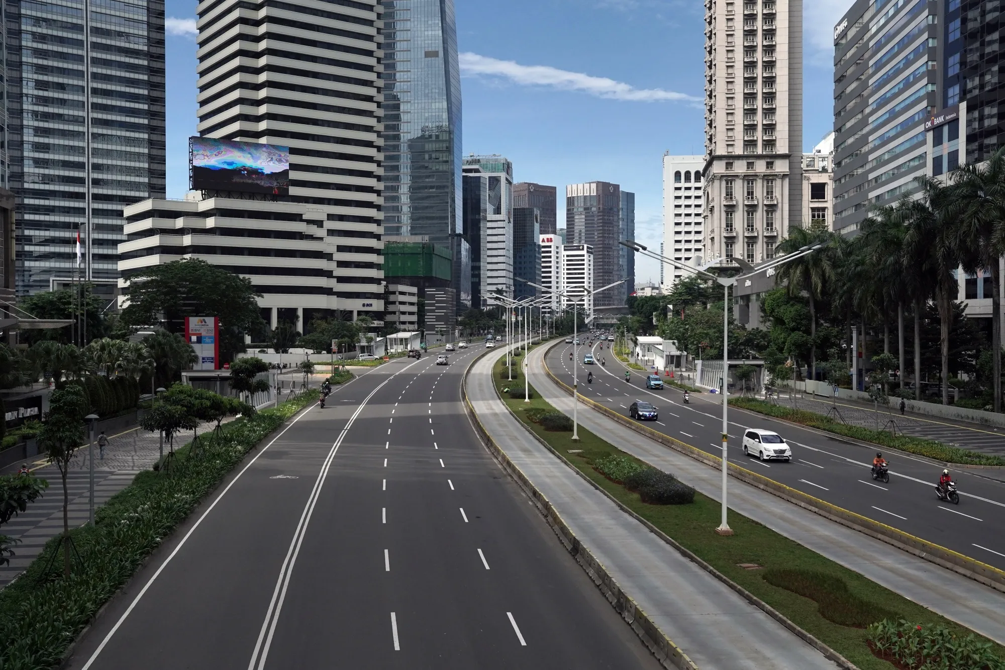 The usually dense traffic and pedestrian lanes in Jakarta are deserted on Jalan Sudirman, April 1.