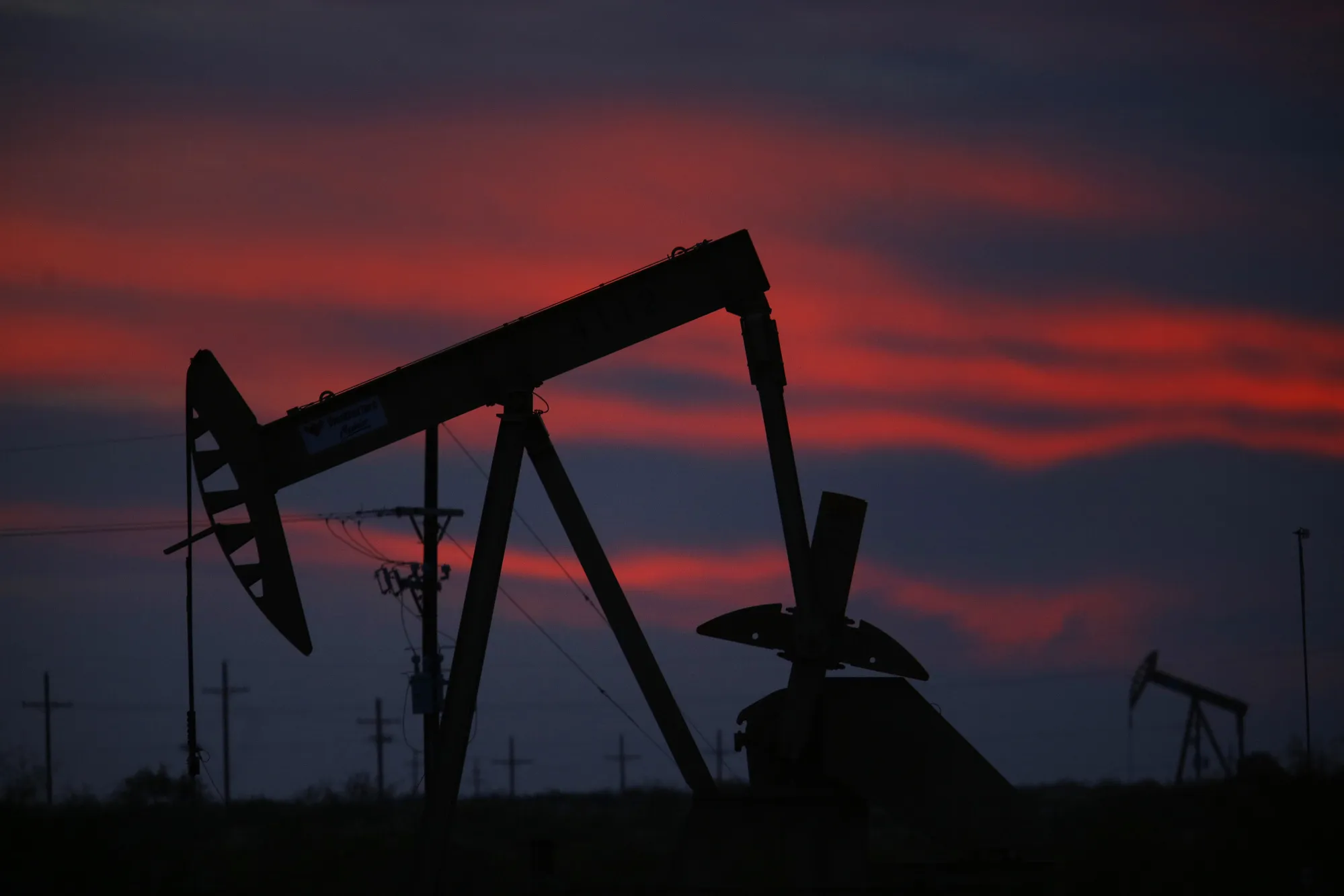 The silhouette of an electric oil pump in Texas, U.S.