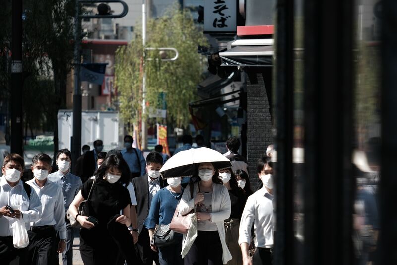 Morning Commuters As Tokyo Will Stay Under State of Emergency