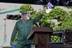 President Miguel Díaz-Canel waves a Cuban flag in Havana on April 16.
