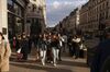 Pedestrians and shoppers walk along Regent Street in London, on April 12.