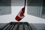 The Canadian flag near the Bank of Canada in Ottawa, Ontario, Canada, on Wednesday, Dec. 11, 2024. The Bank of Canada made its second straight outsize cut in interest rates and signaled policymakers are ready to slow down monetary easing. Photographer: David Kawai/Bloomberg