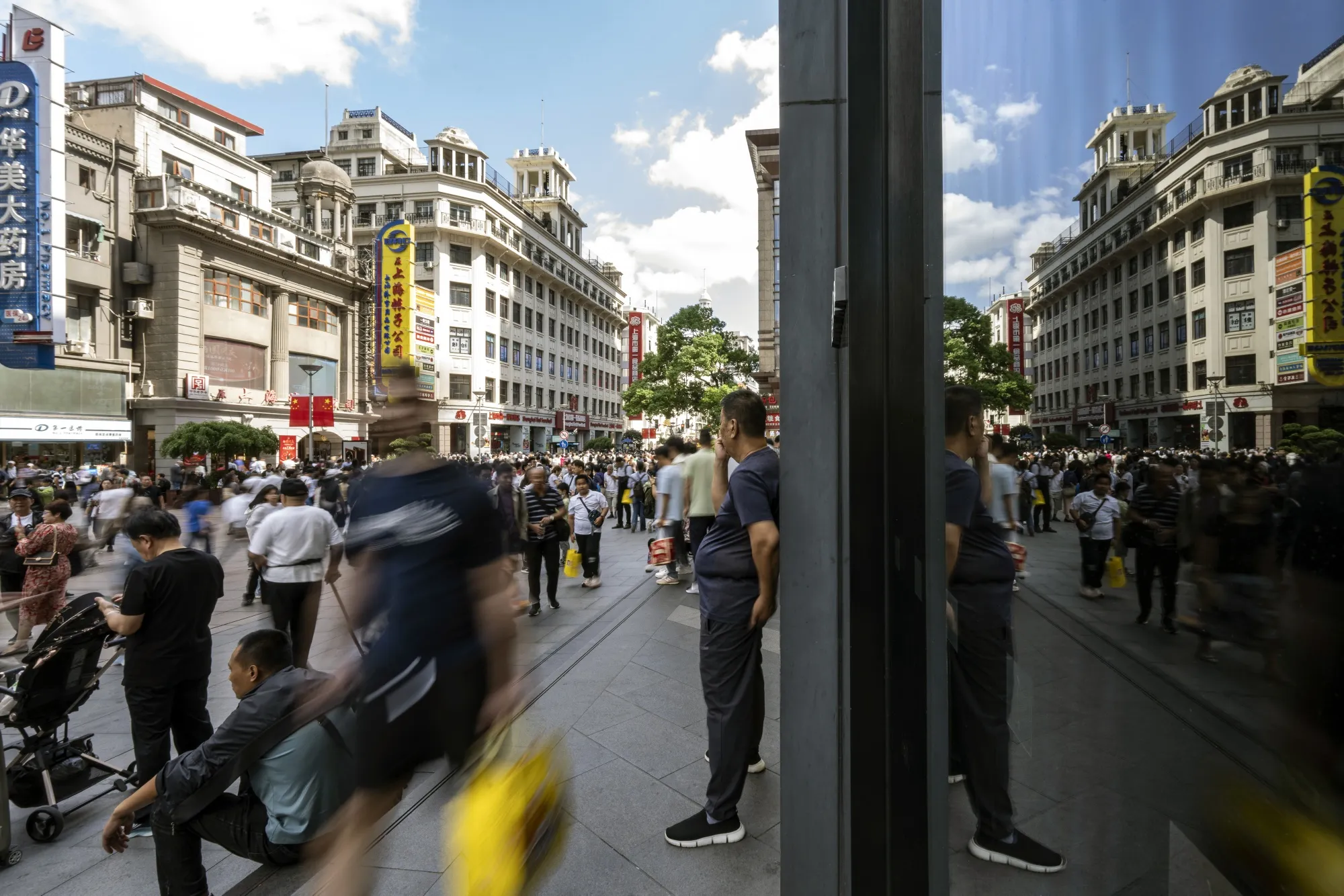 Shoppers on Nanjing East Road in Shanghai.