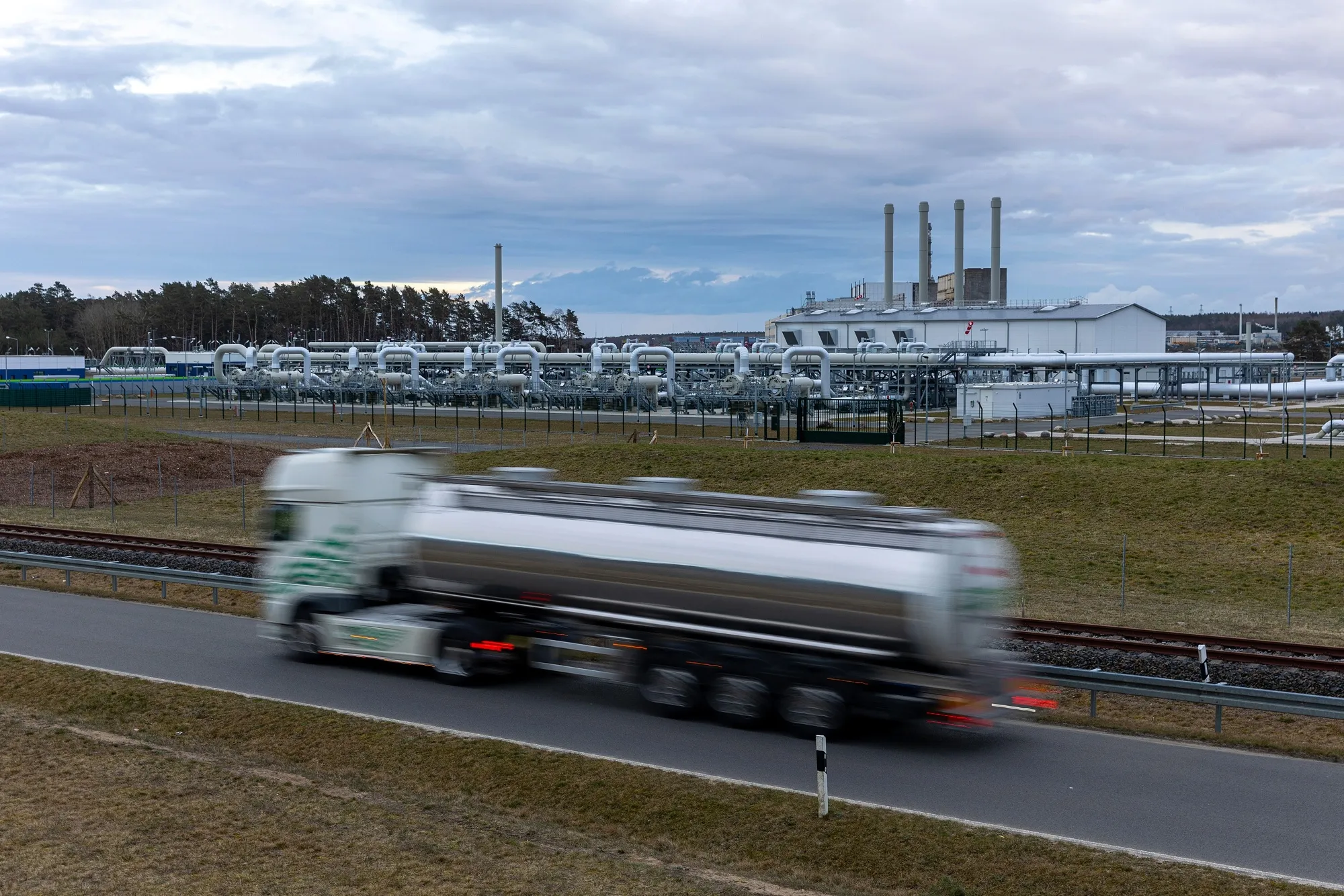 A tanker passes the gas receiving station of the halted Nord Stream 2 project, in Lubmin, Germany.