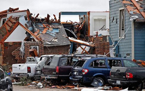 Damaged vehicles and apartments buildings are seen in Garland, Texas on Dec. 28, 2015, after tornadoes hit the area.