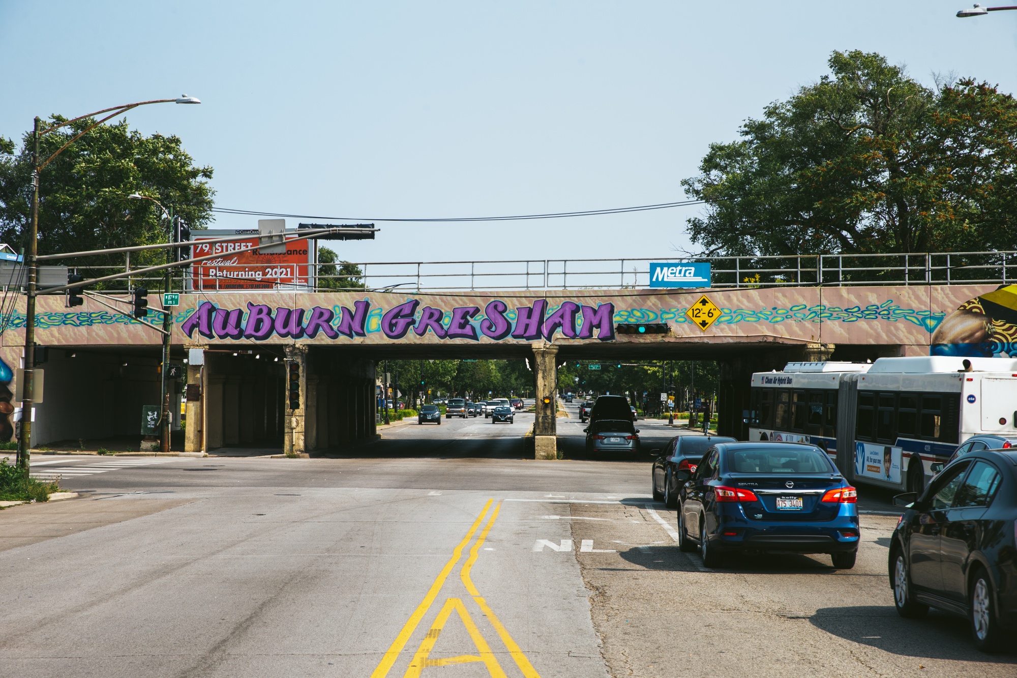 Buses and cars crowd the street in Auburn Gresham.