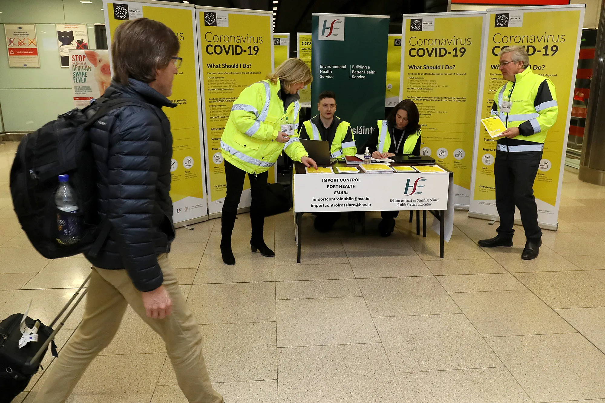A public awareness campaign for coronavirus in the baggage hall at Dublin Airport.