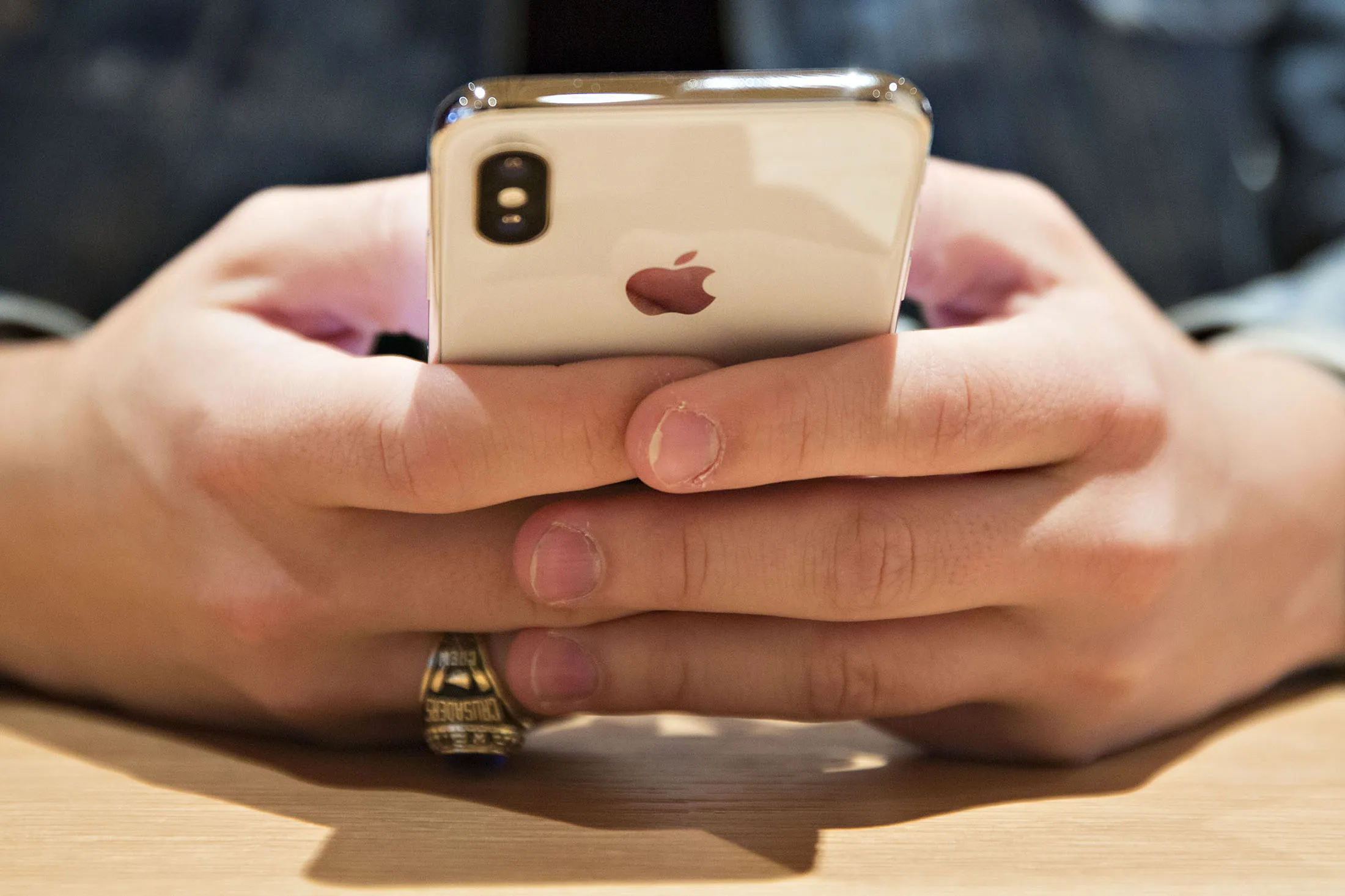 A customer uses an Apple Inc. iPhone X smartphone&nbsp;at an Apple store in Chicago.