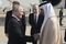 Vladimir Putin is greeted by senior officials in Abu Dhabi on Dec. 6.