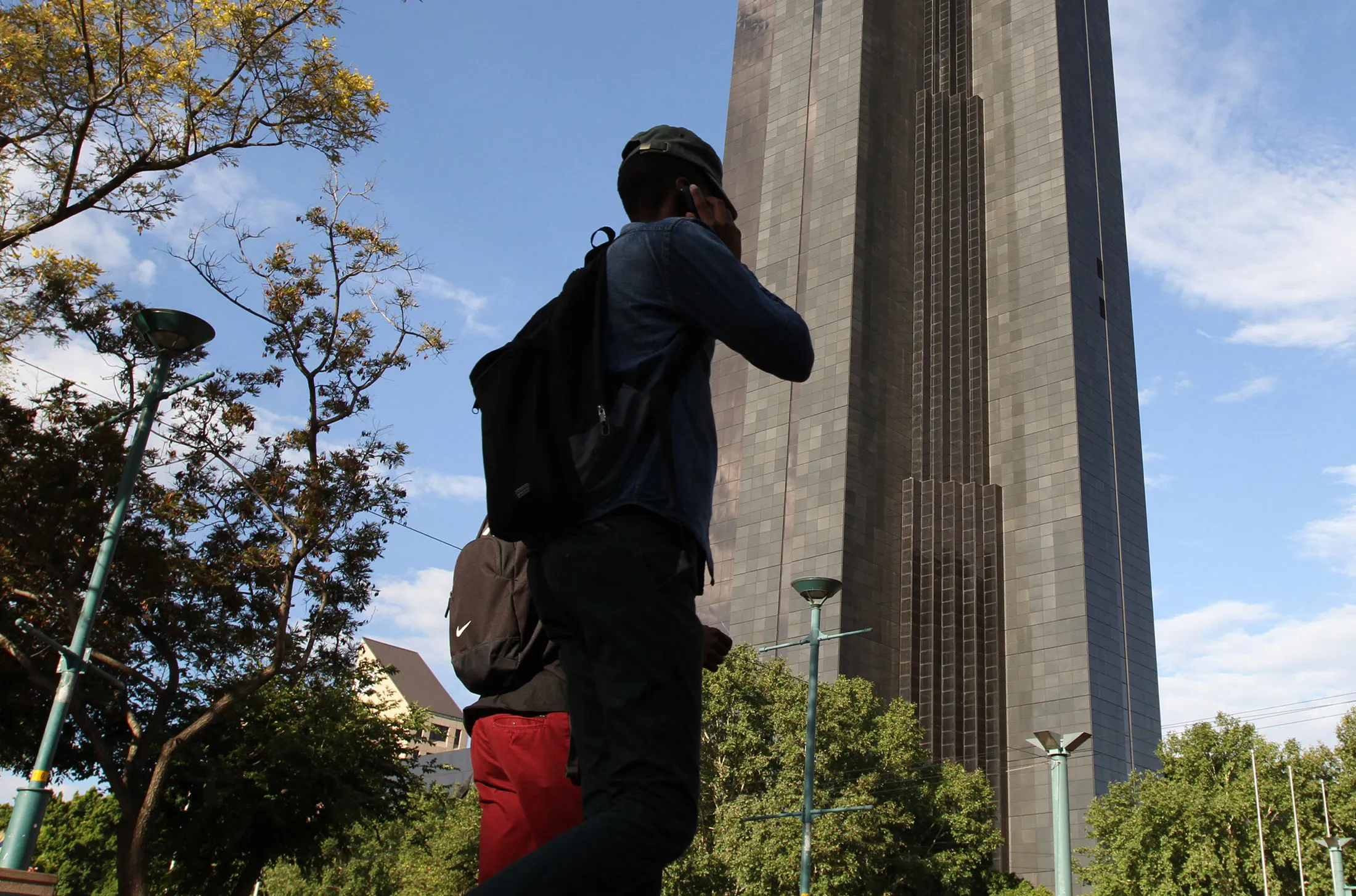 Pedestrians pass the headquarters of the South African Reserve Bank in Pretoria.