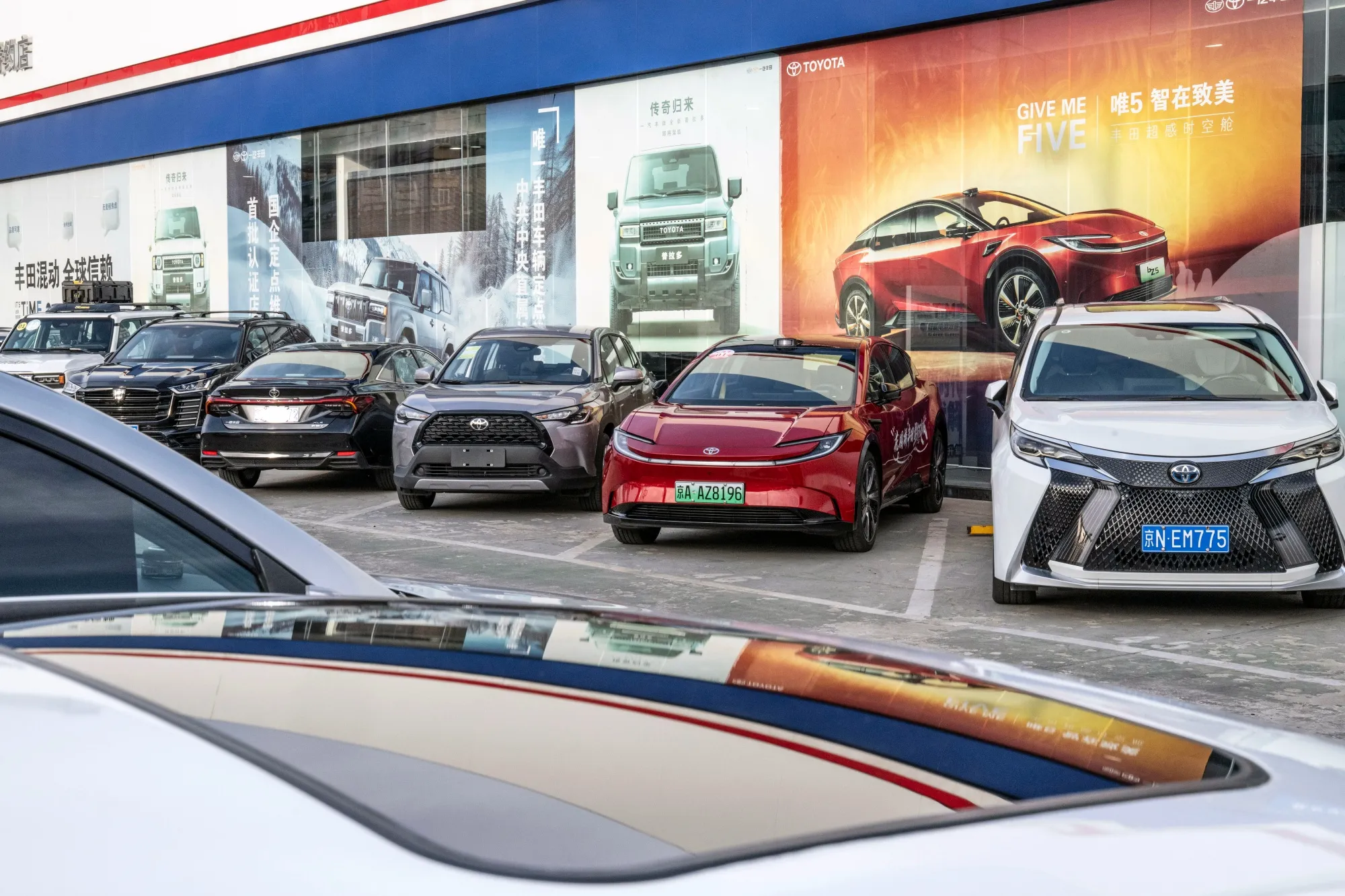 Vehicles parked at a Toyota Motor Corp. dealership in Beijing.