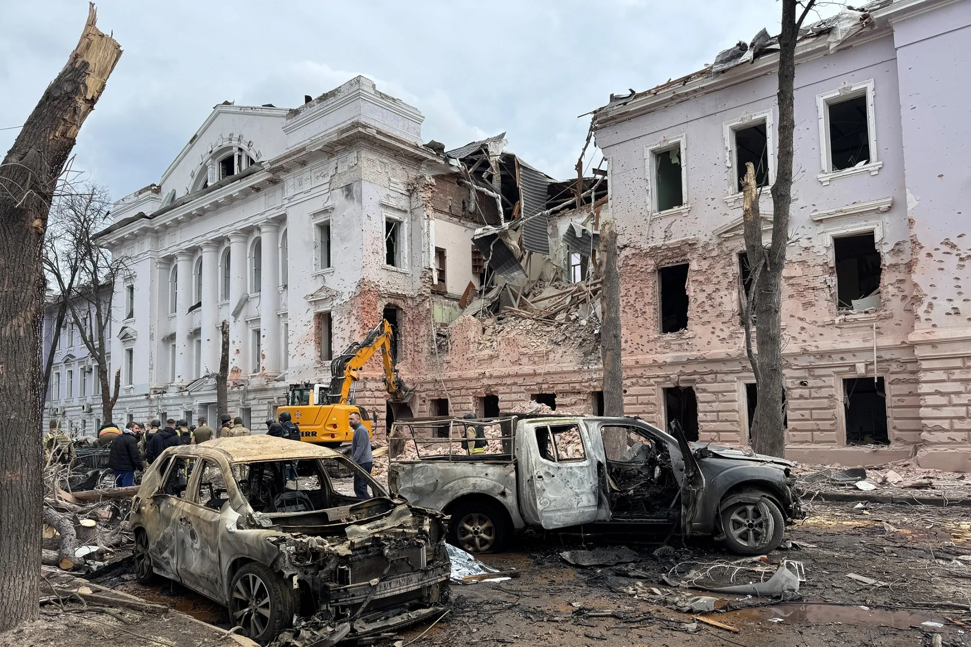 Rescue workers at the scene of a Russian attack&nbsp;in Sumy, Ukraine, on April 13.