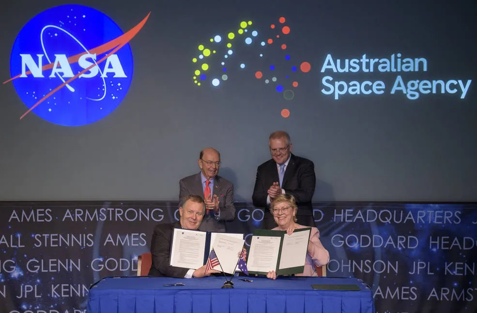Secretary Wilbur Ross and Morrison witness the signing of a letter of intent between NASA and the Australian Space Agency on Saturday.