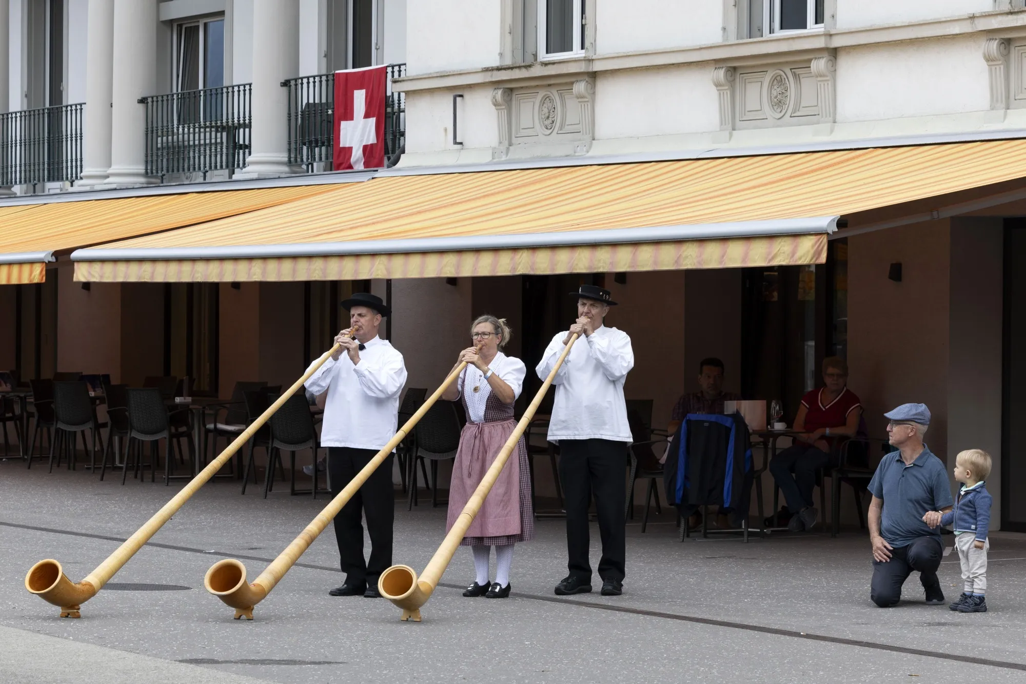 Alphorn blowers perform during Swiss National Day celebrations in Brunnen, Switzerland.