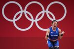 Hidilyn Diaz celebrates after winning the Women's 55kg Weightlifting Group A match on day three of the Tokyo 2020 Olympic Games on July 26.