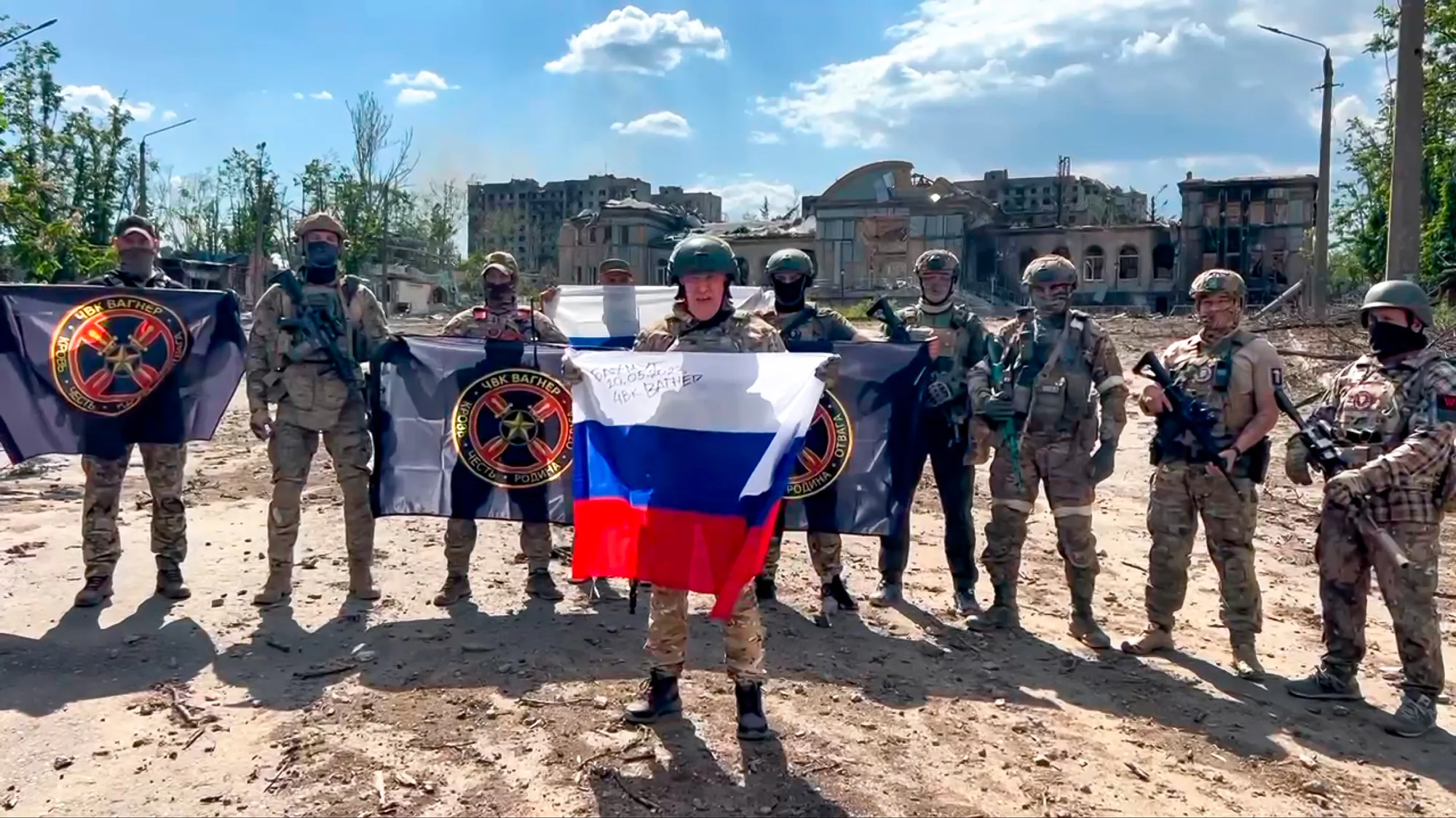 Yevgeny Prigozhin holds a Russian national flag in Bakhmut, Ukraine, on May 21.