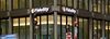 Traffic and pedestrians pass a Fidelity Investments office in Boston.