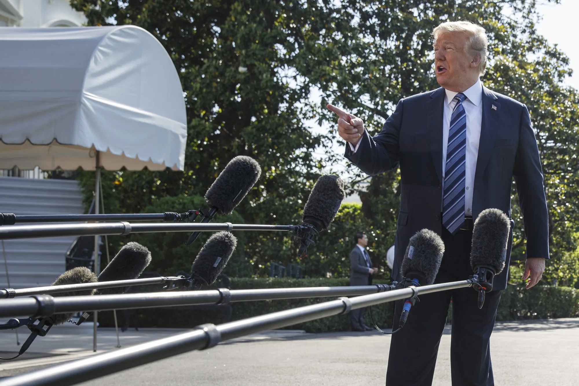 U.S. President Donald Trump speaks to members of the media before boarding Marine One on May 25.