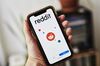 Reddit Inc. signage is displayed on a smartphone in an arranged photograph taken in the Brooklyn borough of New York, U.S., on Tuesday, June 30, 2020. Twitch and Reddit Inc. banned content linked to President Donald Trump for violating their rules against encouraging hate.
