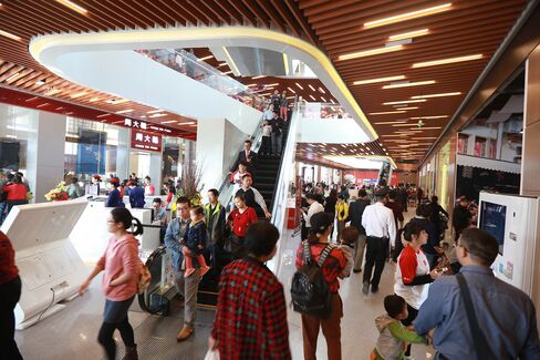 Visitors inside the Qianhai Chow Tai Fook Global Goods Shopping Centre in Qianhai, China.